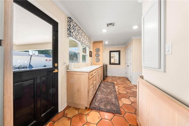 bathroom with recessed lighting, visible vents, plenty of natural light, and crown molding