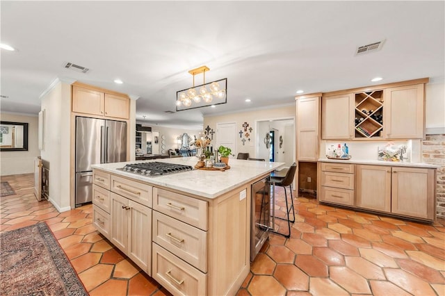 kitchen with light brown cabinetry, visible vents, appliances with stainless steel finishes, and open shelves