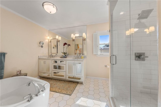 bathroom featuring double vanity, a stall shower, a garden tub, and ornamental molding