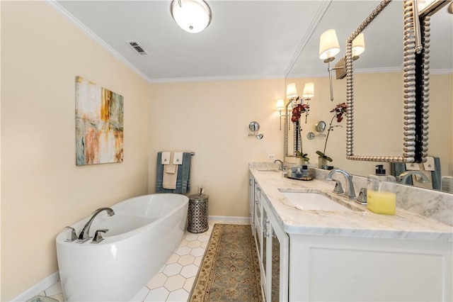 full bath with a sink, a freestanding tub, visible vents, and crown molding