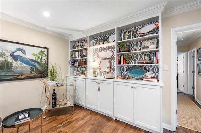 interior space featuring wood finished floors and ornamental molding