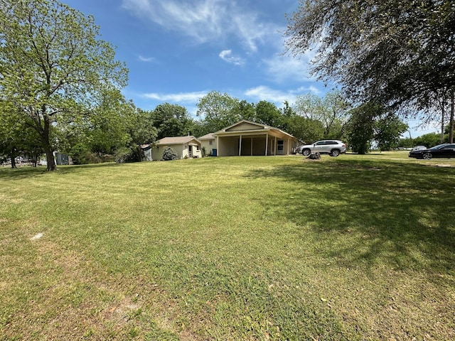 1101 E Palestine St, Mexia, TX 76667 - view of yard featuring a carport