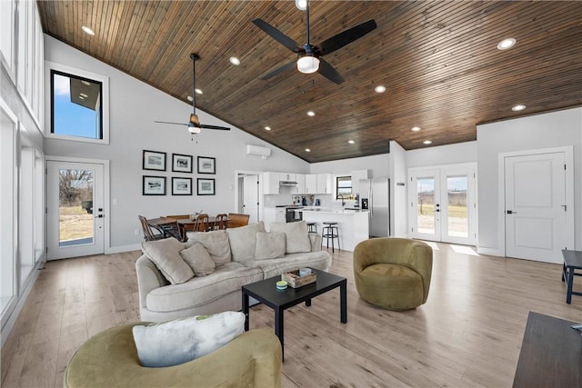 living room featuring wooden ceiling, a ceiling fan, and high vaulted ceiling