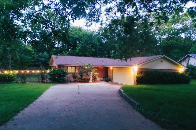 411 Brookwood Dr, Woodway, TX 76712 - single story home featuring a front yard, concrete driveway, and an attached garage