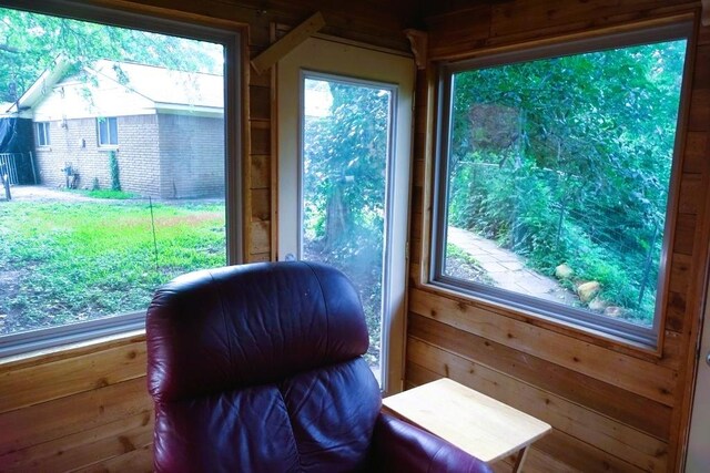 411 Brookwood Dr, Woodway, TX 76712 - living area featuring wooden walls and healthy amount of natural light