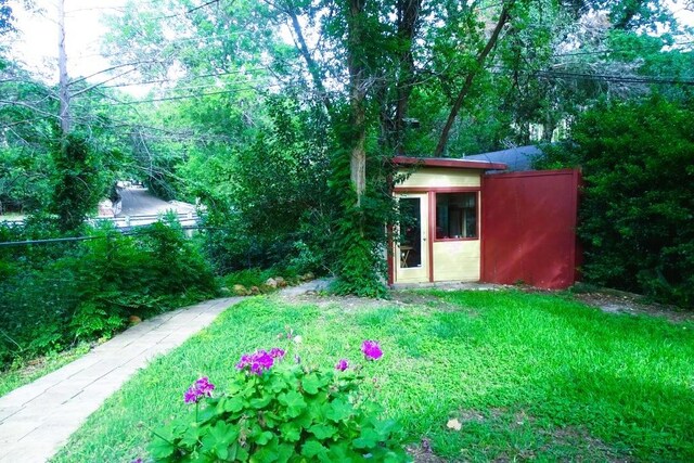 411 Brookwood Dr, Woodway, TX 76712 - view of grassy yard with an outbuilding