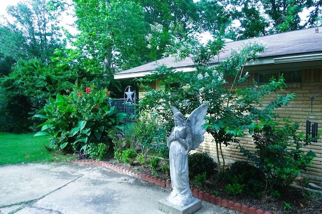 411 Brookwood Dr, Woodway, TX 76712 - view of side of home with a patio