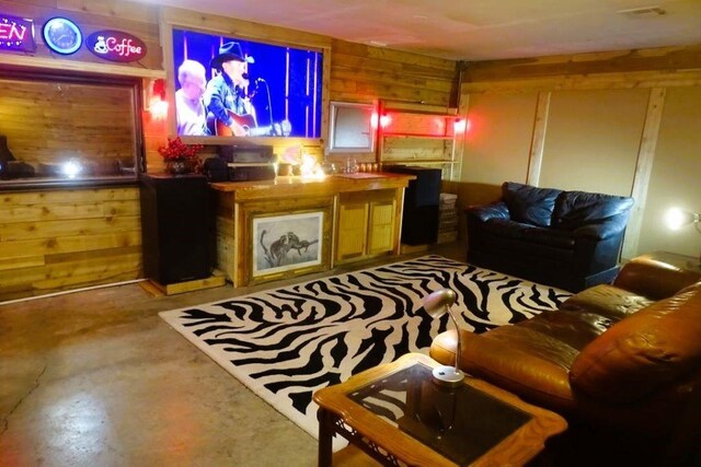 411 Brookwood Dr, Woodway, TX 76712 - living area with wood walls and concrete floors