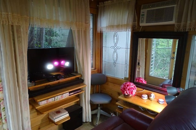 sitting room with an AC wall unit