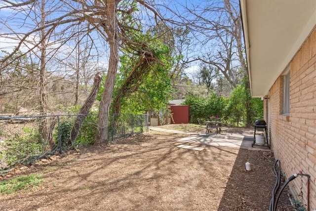 view of yard with a patio and fence
