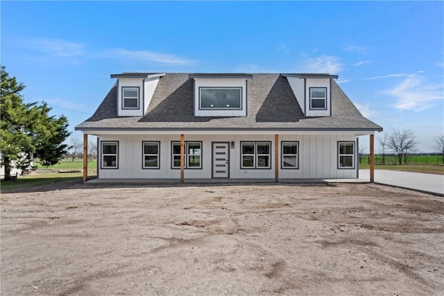 view of front of house featuring a porch and roof with shingles