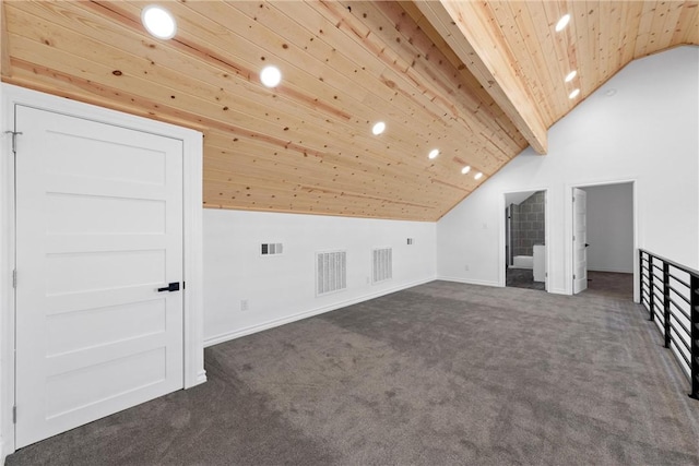 bonus room featuring wooden ceiling, visible vents, dark colored carpet, and vaulted ceiling