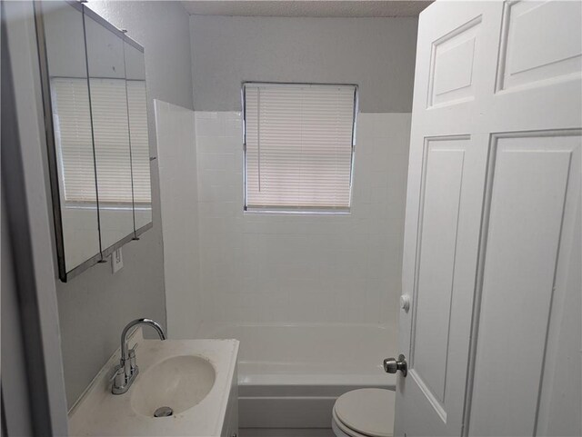 full bath featuring shower / bathtub combination, toilet, and vanity