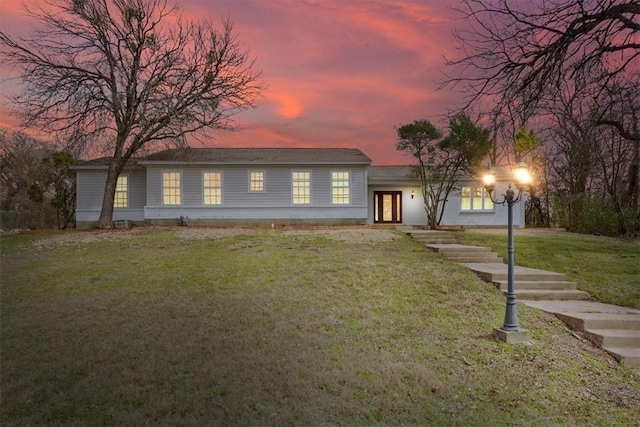 view of front of home featuring a front yard