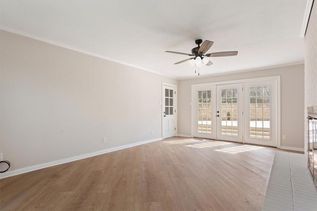 unfurnished room featuring ornamental molding, french doors, light wood-style floors, baseboards, and ceiling fan