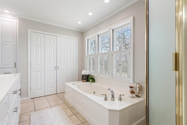 full bath with tile patterned floors, ornamental molding, recessed lighting, a tub with jets, and vanity