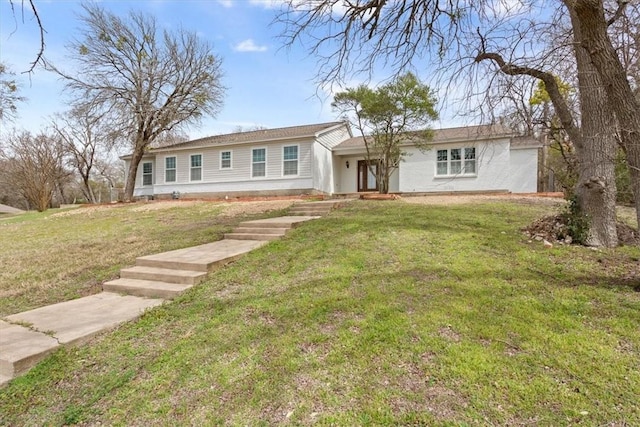 single story home with a front lawn