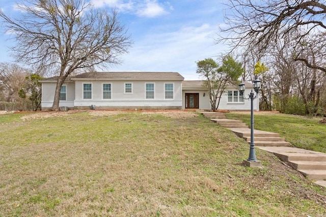 ranch-style house with a front yard