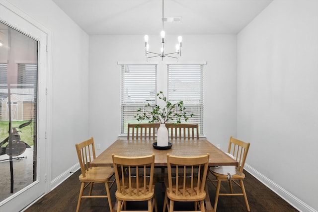 2905 Shires Dr, Mansfield, TX 76084 - dining room with a chandelier, dark wood-style flooring, and baseboards