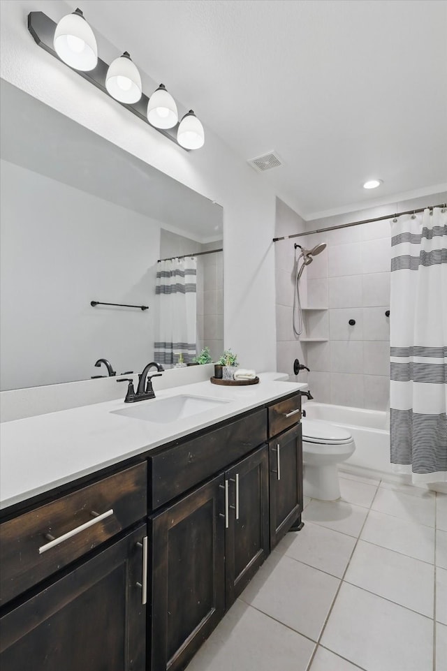 full bath with tile patterned floors, visible vents, toilet, vanity, and shower / tub combo with curtain