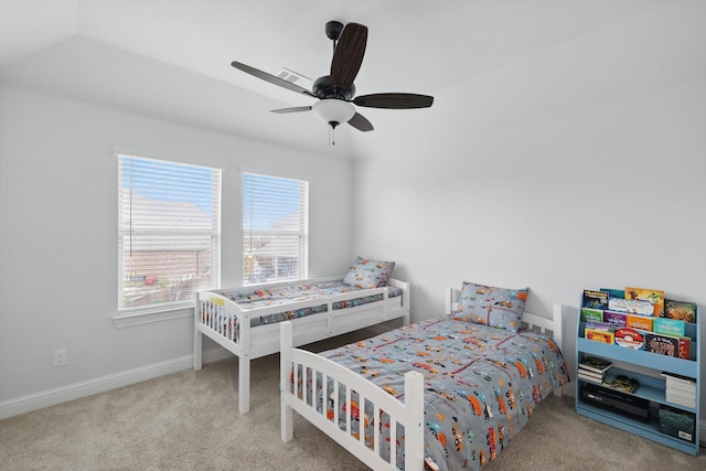 carpeted bedroom with baseboards and ceiling fan