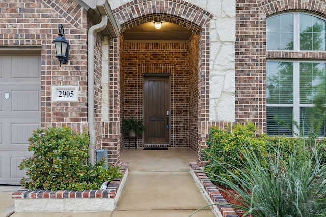 2905 Shires Dr, Mansfield, TX 76084 - doorway to property featuring brick siding and a garage