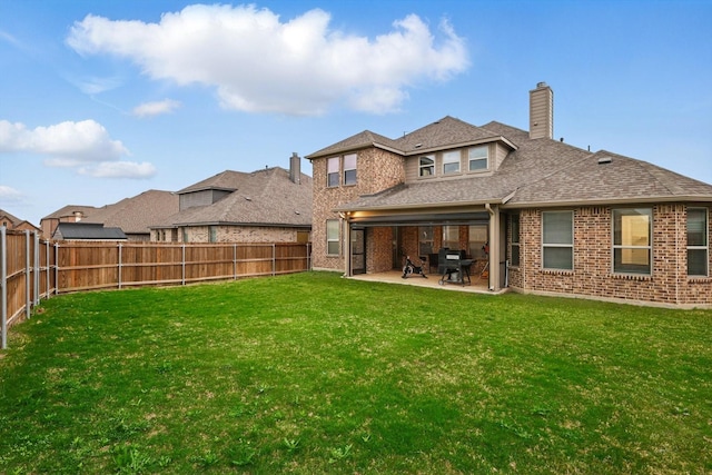 2905 Shires Dr, Mansfield, TX 76084 - back of property with brick siding, a patio area, a chimney, and a shingled roof