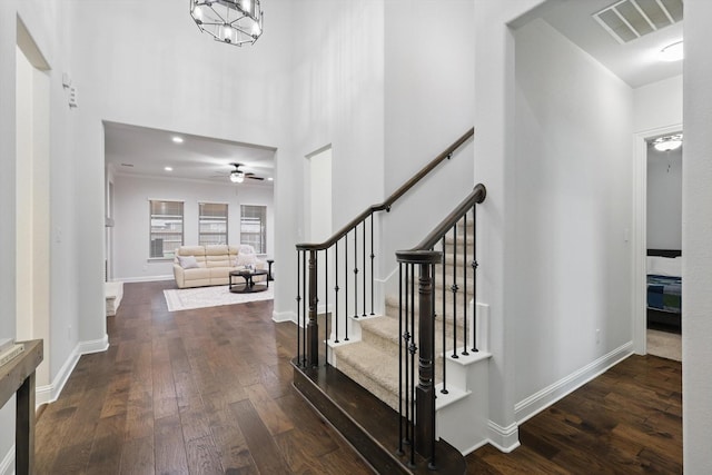 2905 Shires Dr, Mansfield, TX 76084 - entryway featuring dark wood-style floors, a ceiling fan, baseboards, stairs, and a high ceiling