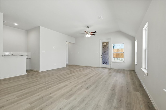 1436 Odette Dr, Arlington, TX 76013 - unfurnished living room featuring ceiling fan, light wood-style flooring, and lofted ceiling
