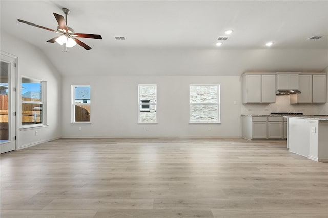 1436 Odette Dr, Arlington, TX 76013 - unfurnished living room featuring lofted ceiling, ceiling fan, light wood finished floors, and recessed lighting