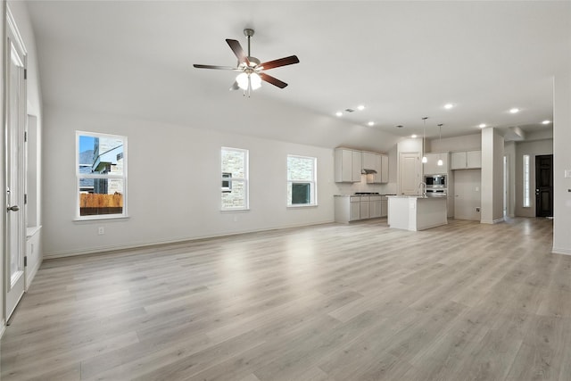 1436 Odette Dr, Arlington, TX 76013 - unfurnished living room with light wood finished floors, ceiling fan, and recessed lighting