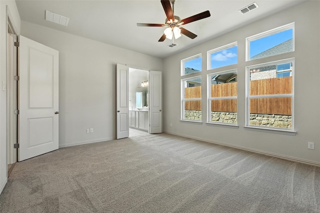 1436 Odette Dr, Arlington, TX 76013 - unfurnished bedroom featuring carpet, ceiling fan, and ensuite bath