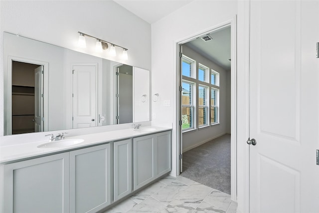 1436 Odette Dr, Arlington, TX 76013 - full bathroom featuring double vanity and marble finish flooring