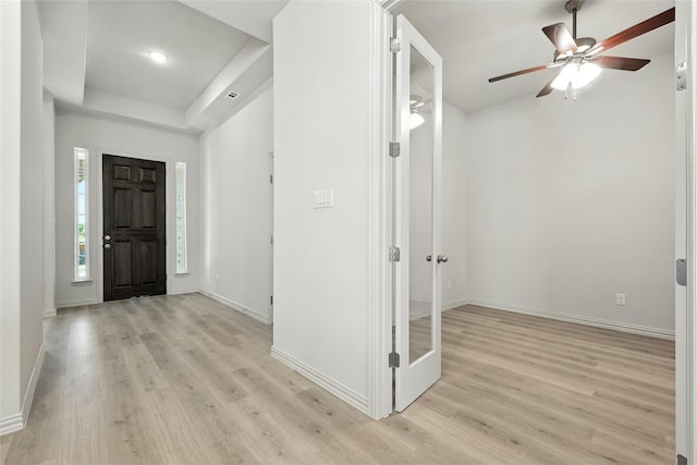 1436 Odette Dr, Arlington, TX 76013 - entrance foyer featuring light wood-style floors, ceiling fan, and a raised ceiling