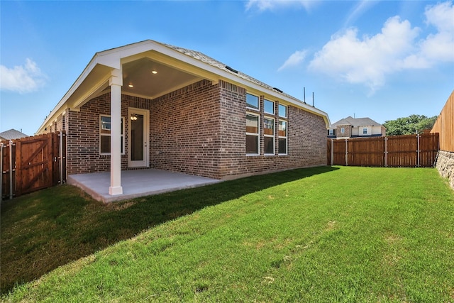 1436 Odette Dr, Arlington, TX 76013 - rear view of property featuring brick siding, a patio, and a fenced backyard