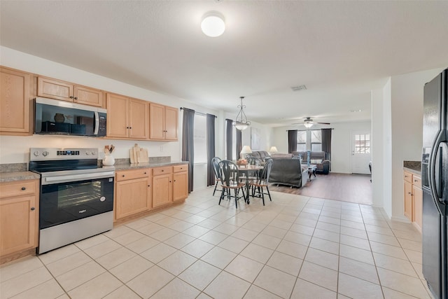 kitchen with light tile patterned floors, light brown cabinets, visible vents, stainless steel appliances, and open floor plan