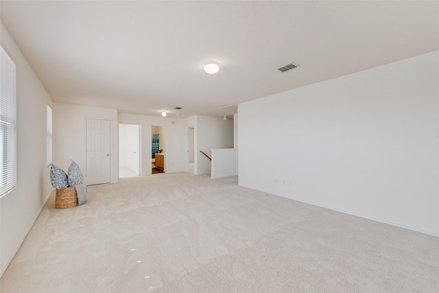 carpeted spare room with visible vents