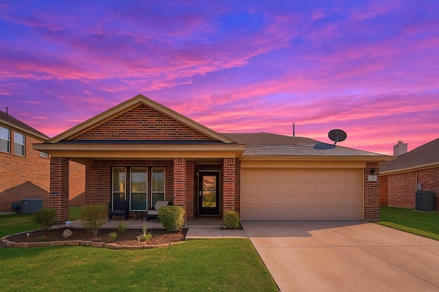 ranch-style house featuring a porch, concrete driveway, a garage, and brick siding