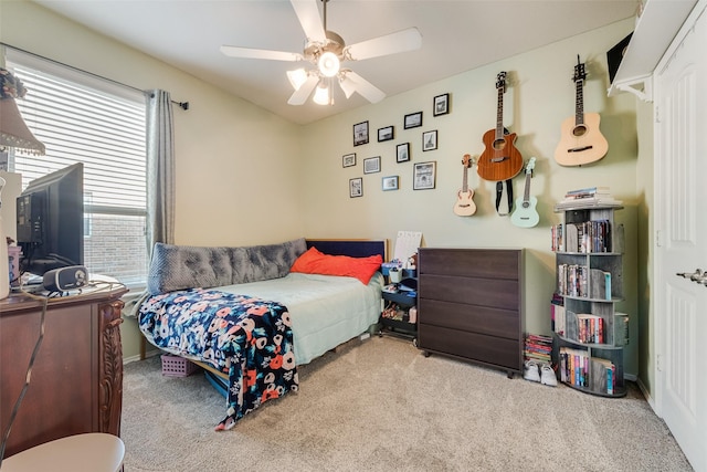 bedroom with ceiling fan and carpet floors