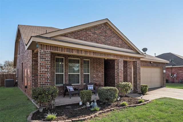 view of front of property featuring a porch, a front lawn, a garage, brick siding, and concrete driveway