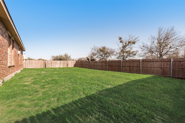 view of yard featuring a fenced backyard