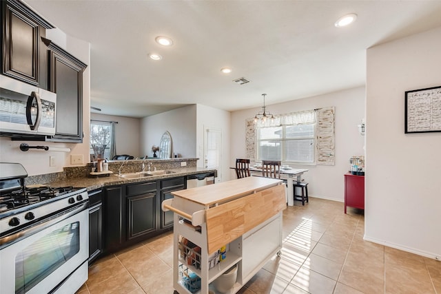 kitchen with visible vents, stainless steel appliances, recessed lighting, and a sink