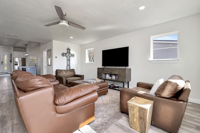 6837 Briar Rd, Azle, TX 76020 - living room with light wood-style flooring, ceiling fan, and recessed lighting