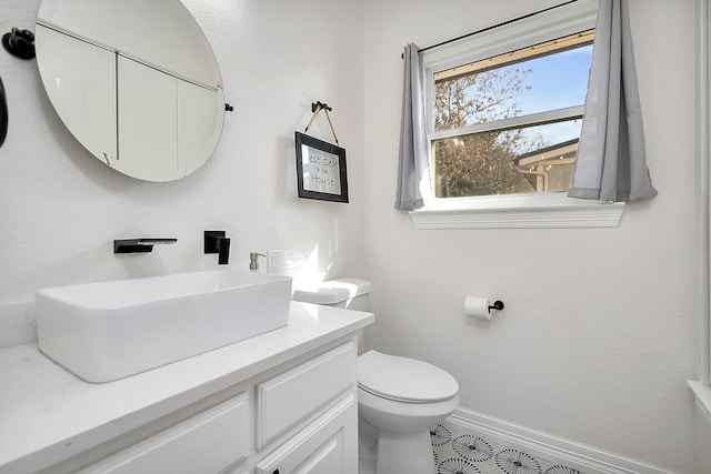 6837 Briar Rd, Azle, TX 76020 - bathroom featuring toilet, vanity, and baseboards