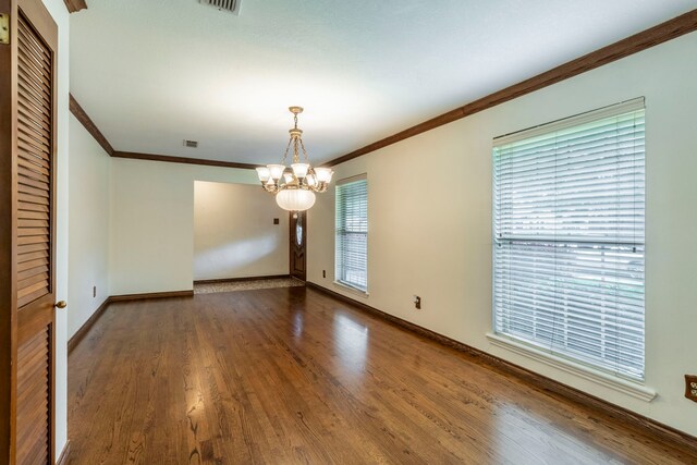 2881 Selma Ln, Farmers Branch, TX 75234 - unfurnished room featuring a chandelier, crown molding, a textured ceiling, and wood finished floors