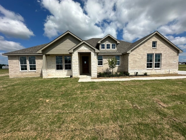 2465 Blackjack Oak Rd, Oak Ridge, TX 75161 - craftsman-style house with a front lawn, a shingled roof, stone siding, and brick siding