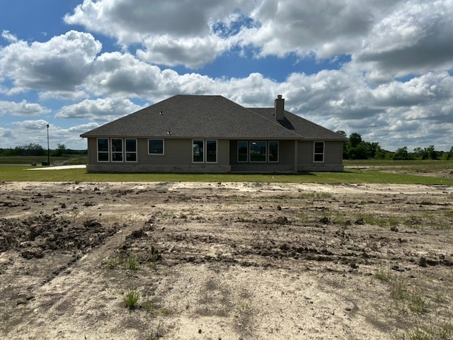 2465 Blackjack Oak Rd, Oak Ridge, TX 75161 - rear view of house featuring a chimney