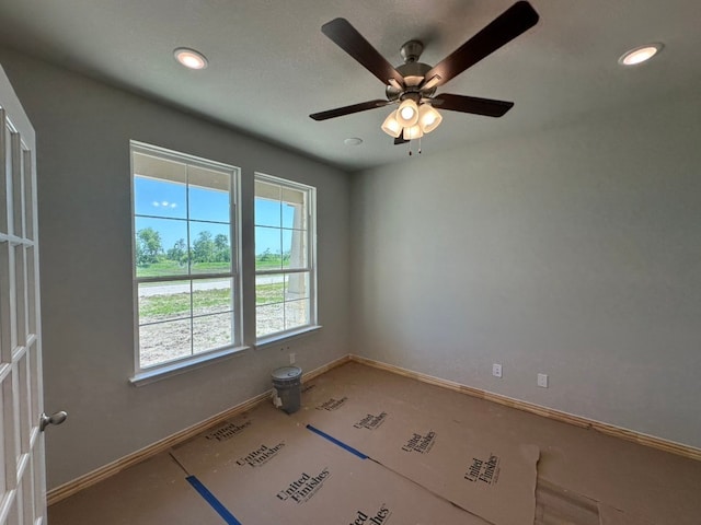 unfurnished room with ceiling fan, baseboards, and recessed lighting