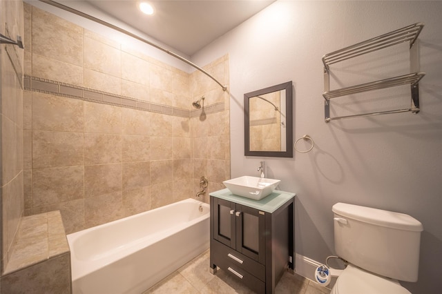 full bathroom with tile patterned floors, vanity, toilet, and washtub / shower combination