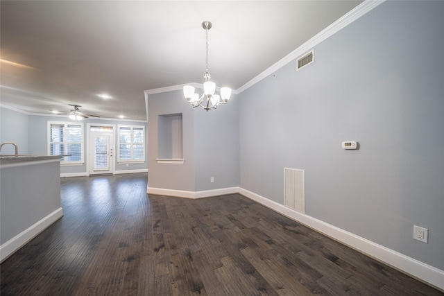 spare room with visible vents, baseboards, dark wood-style floors, and ornamental molding